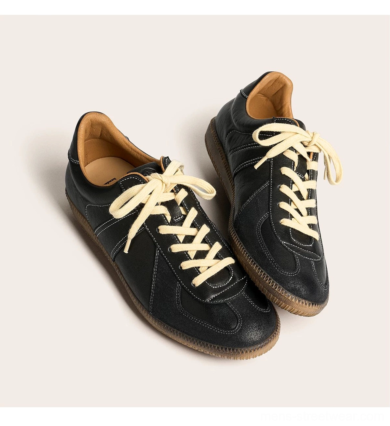 Black vintage leather streetwear sneakers with visible stitching tan lining and gum rubber sole