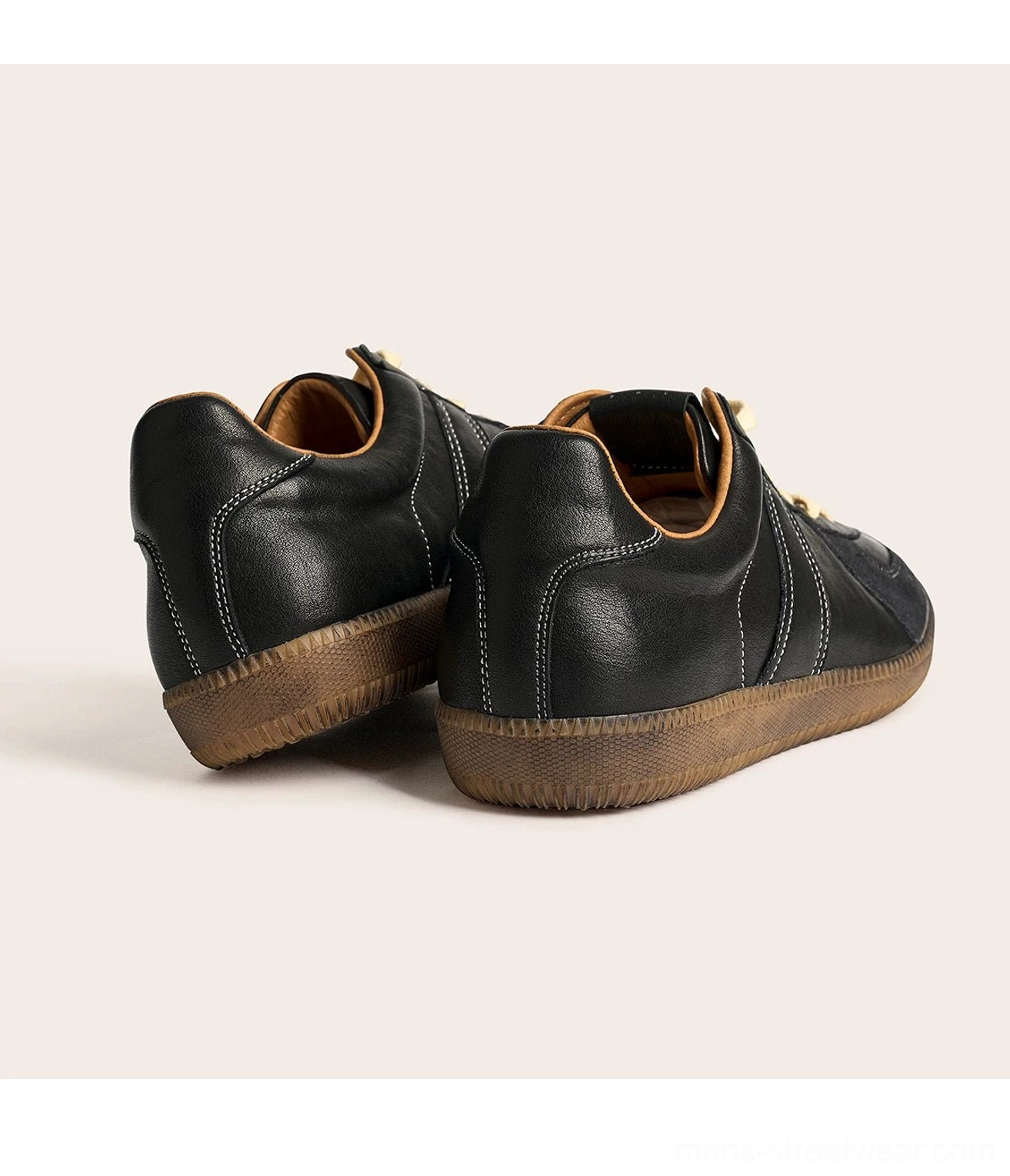 Rear view of black vintage leather trainer sneakers with heel counter contrast stitching and gum sole