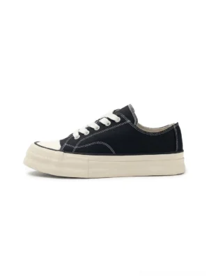 Black vulcanized canvas platform low-top sneakers with off-white rubber sole and classic round toe cap side view