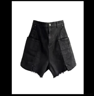 Front flat lay of black washed cargo denim shorts with oversized side pockets zip fly and uneven raw frayed hems