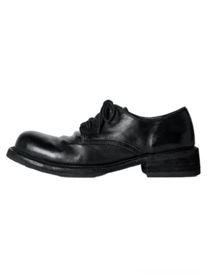 Black washed horsehide round-toe derby shoes shown in a left-side product view with polished leather, lace-up closure, contrast welt, and low stacked heel