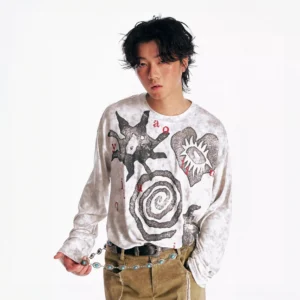 Black washed tribal graphic oversized long sleeve tee on male model styled with khaki cargo pants and chain belt