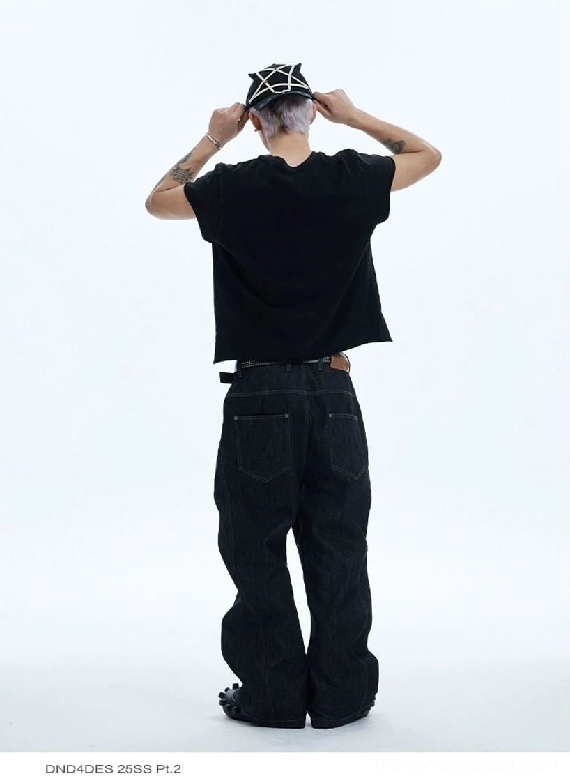 Rear view of loose black washed wide-leg jeans with classic five-pocket construction for contemporary streetwear