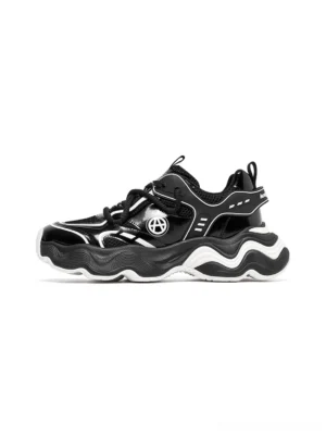 Black wave-sole chunky dad sneakers shown in side profile with layered mesh panels, circular hardware details, and a thick contrasting sculpted outsole