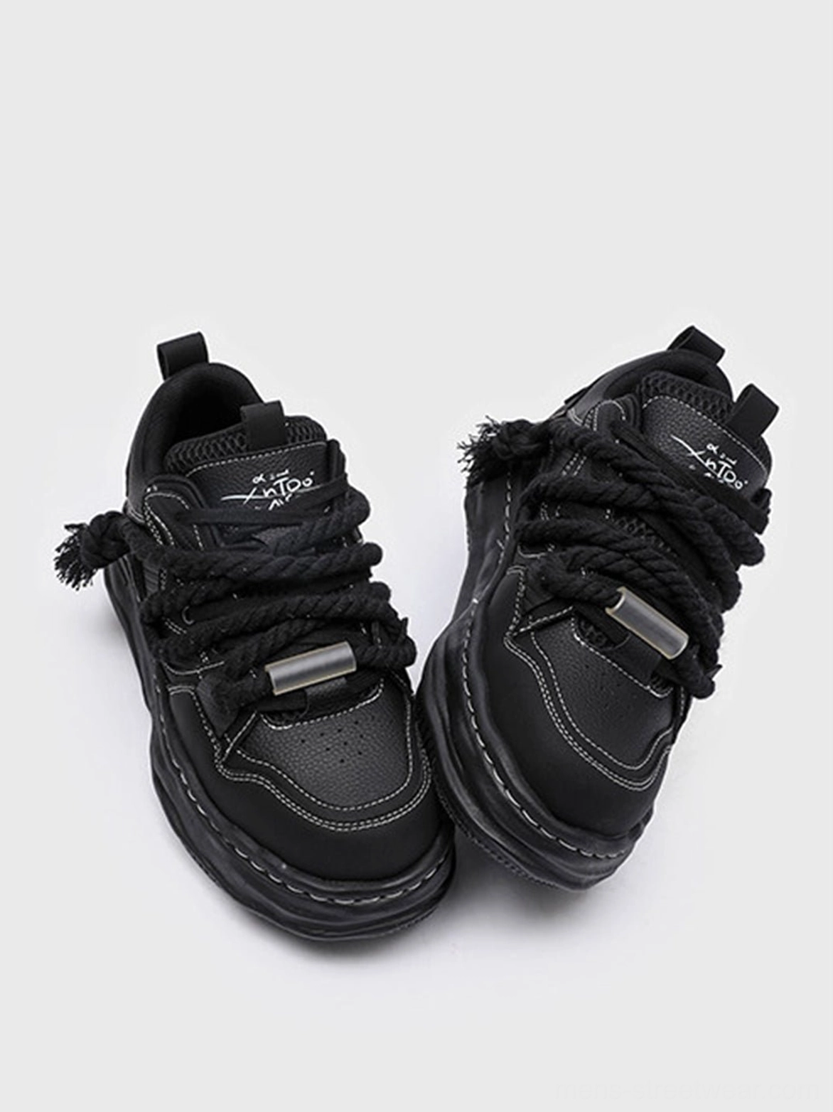 Black wavy sole sneakers with approximately 7CM height effect, matte finish, bold proportions, and versatile everyday streetwear appeal