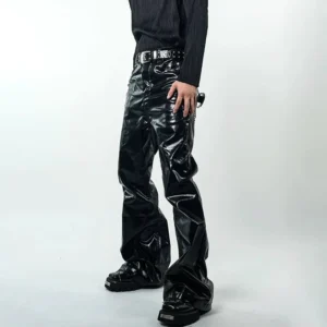 Black wet-look vinyl flared pants front three-quarter view with glossy cyber streetwear finish