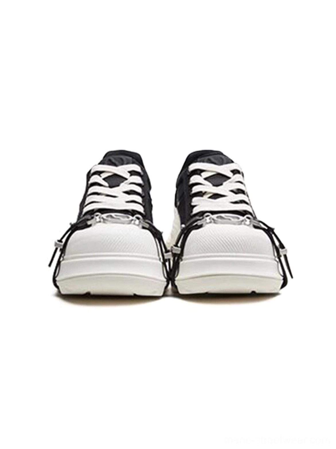 Front view of black and white buckle platform canvas sneakers with silver toe buckles, white laces, and thick white platform soles