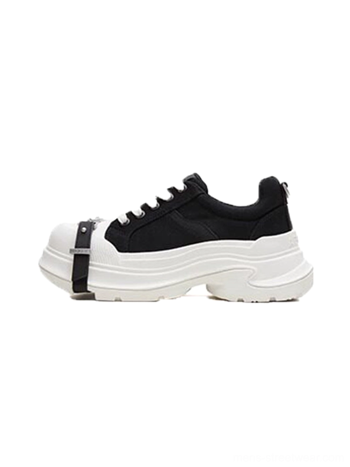 Black and white buckle platform canvas sneaker left side view with silver toe strap, white laces, black upper, and chunky wave sole