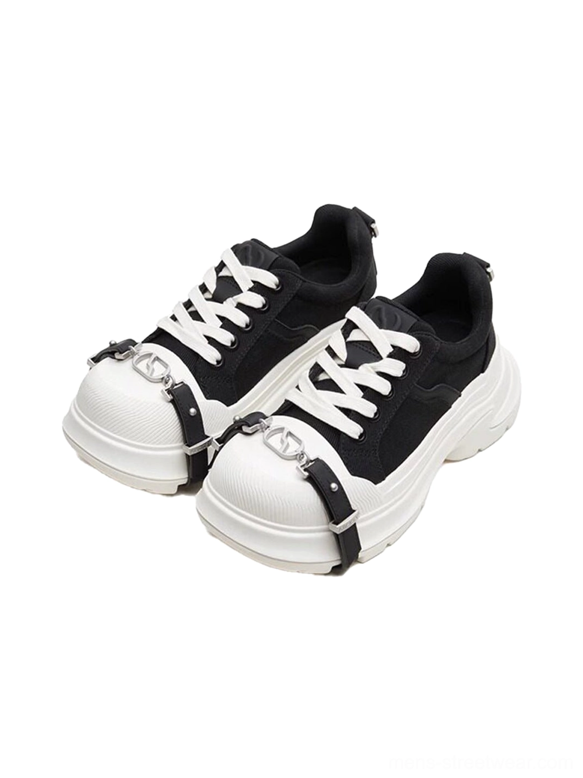 Pair of black and white buckle platform canvas sneakers front flat lay showing white laces, contrast toe caps, and chunky soles