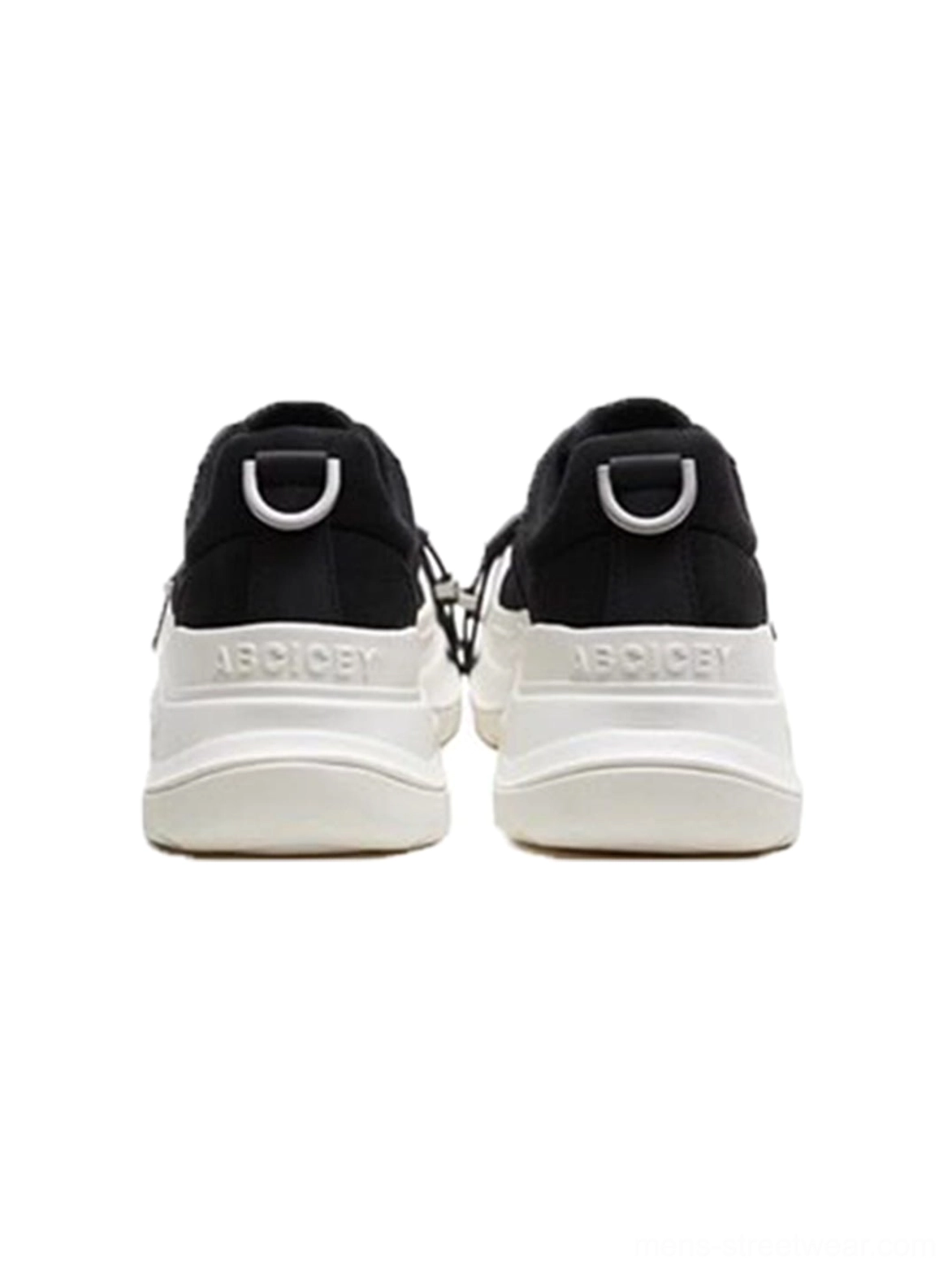 Rear view of black and white buckle platform canvas sneakers showing black heel panels, pull loops, branded midsole text, and thick soles