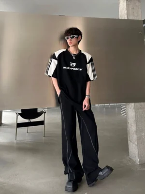 Black and white colorblock sport tee with bold chest graphic and oversized Korean streetwear silhouette