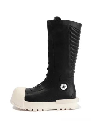 Black and white contrast toe mid-calf platform boot left side view with ruched PU leather shaft and thick off-white tread sole