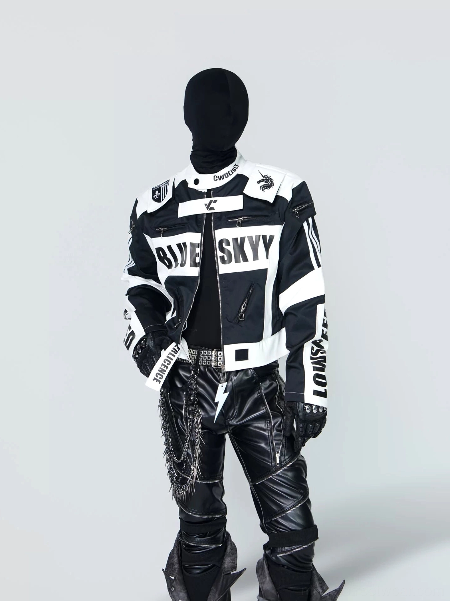 Black and white cropped graphic racing jacket front view with stand collar, zip closure, contrast panels and bold streetwear lettering