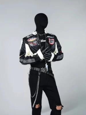 Black and white cropped racing jacket front view with motorsport lettering patches stand collar and zip closure
