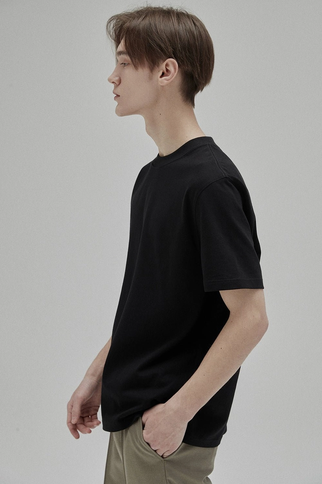 Black or white fitted cotton T-shirt foundation for cargo pants, denim, trousers, and sneakers