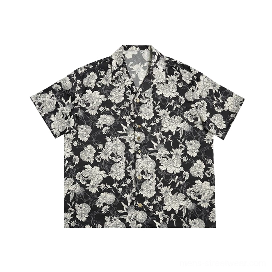 Flat lay black and white floral Hawaiian shirt with short sleeves notch camp collar and boxy fit