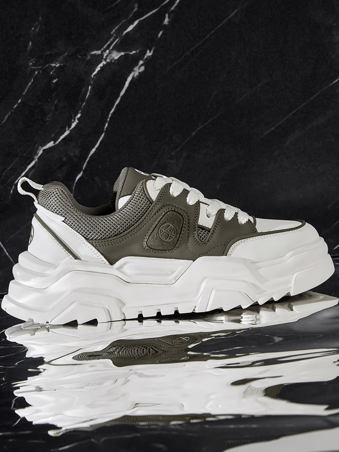 Black and white geometric platform sneaker worn styling ground perspective showing authentic streetwear integration and on-body proportions