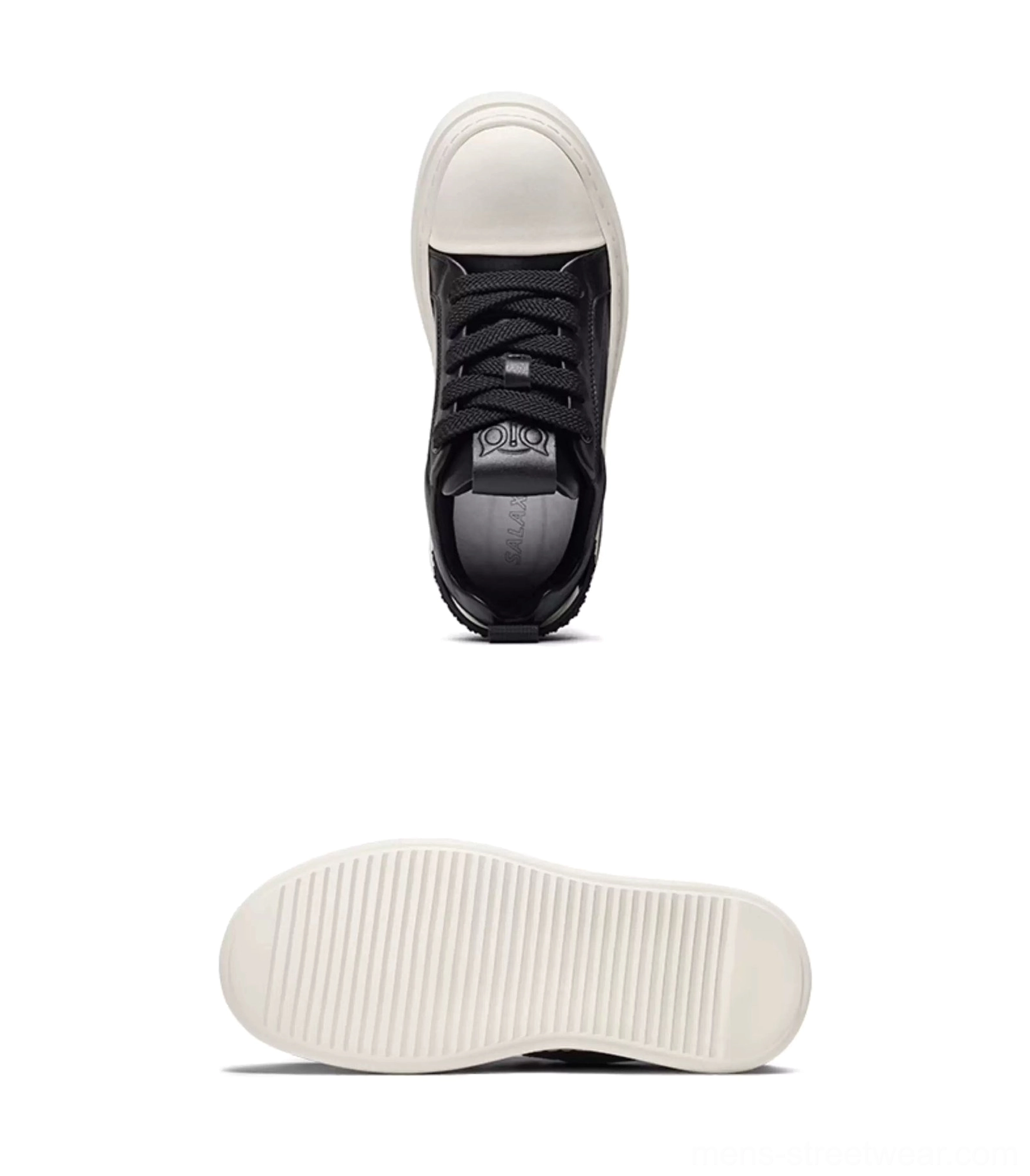 Top view of black and white platform sneaker interior showing black laces, leather insole, and white toe cap