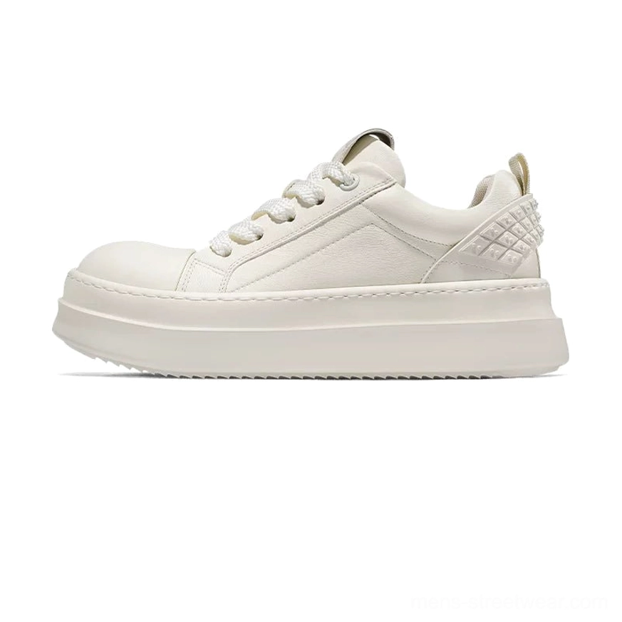 Black and white leather platform sneakers in front three-quarter view with white toe cap and thick flatform sole