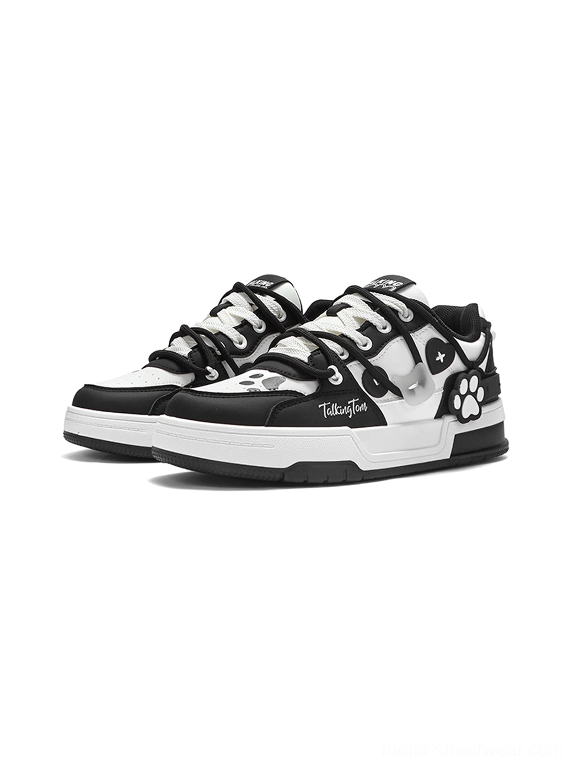 Black and white paw print low-top court sneakers with contrasting panels, graphic details, and flat rubber sole