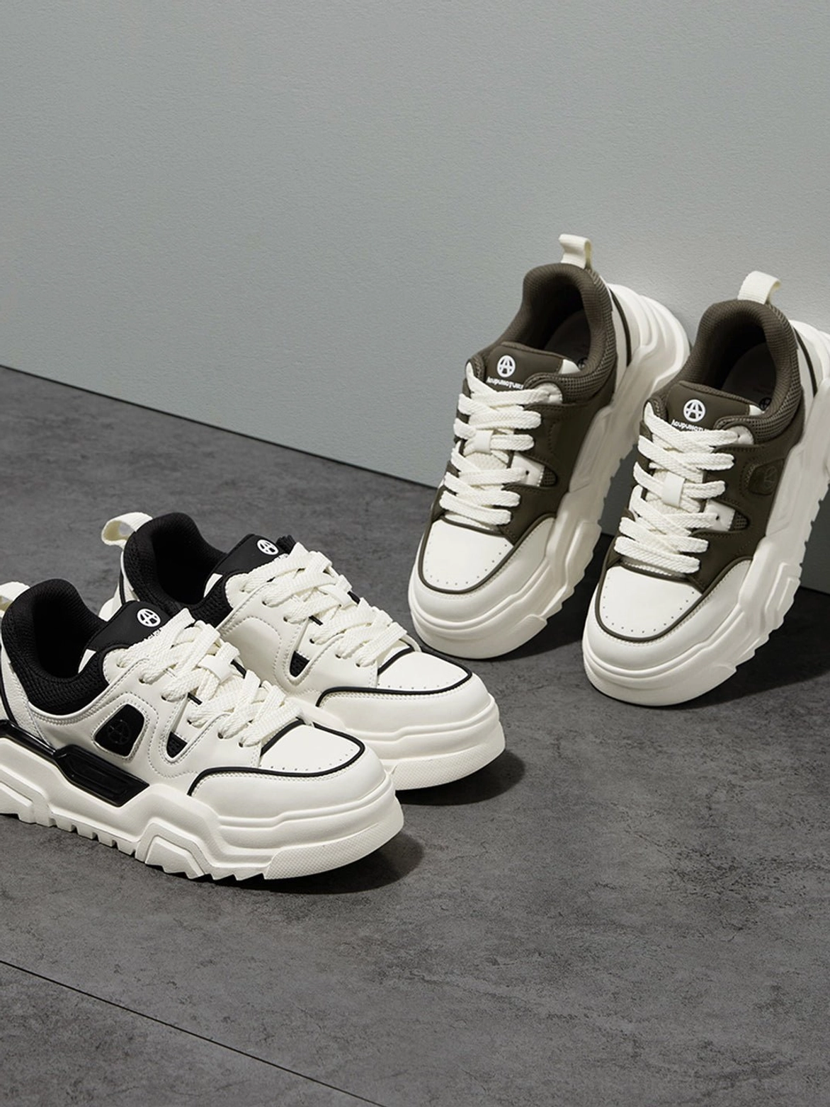 Black and white platform sneaker ultimate lifestyle action shot dynamic urban environment streetwear culture authentic on-body presence display