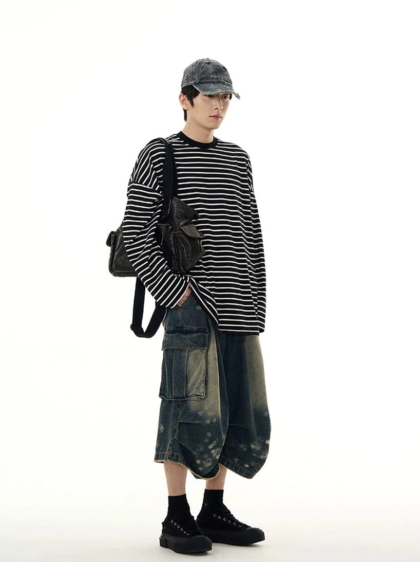Right side view of a relaxed oversized black and white striped long sleeve tee styled for Korean streetwear