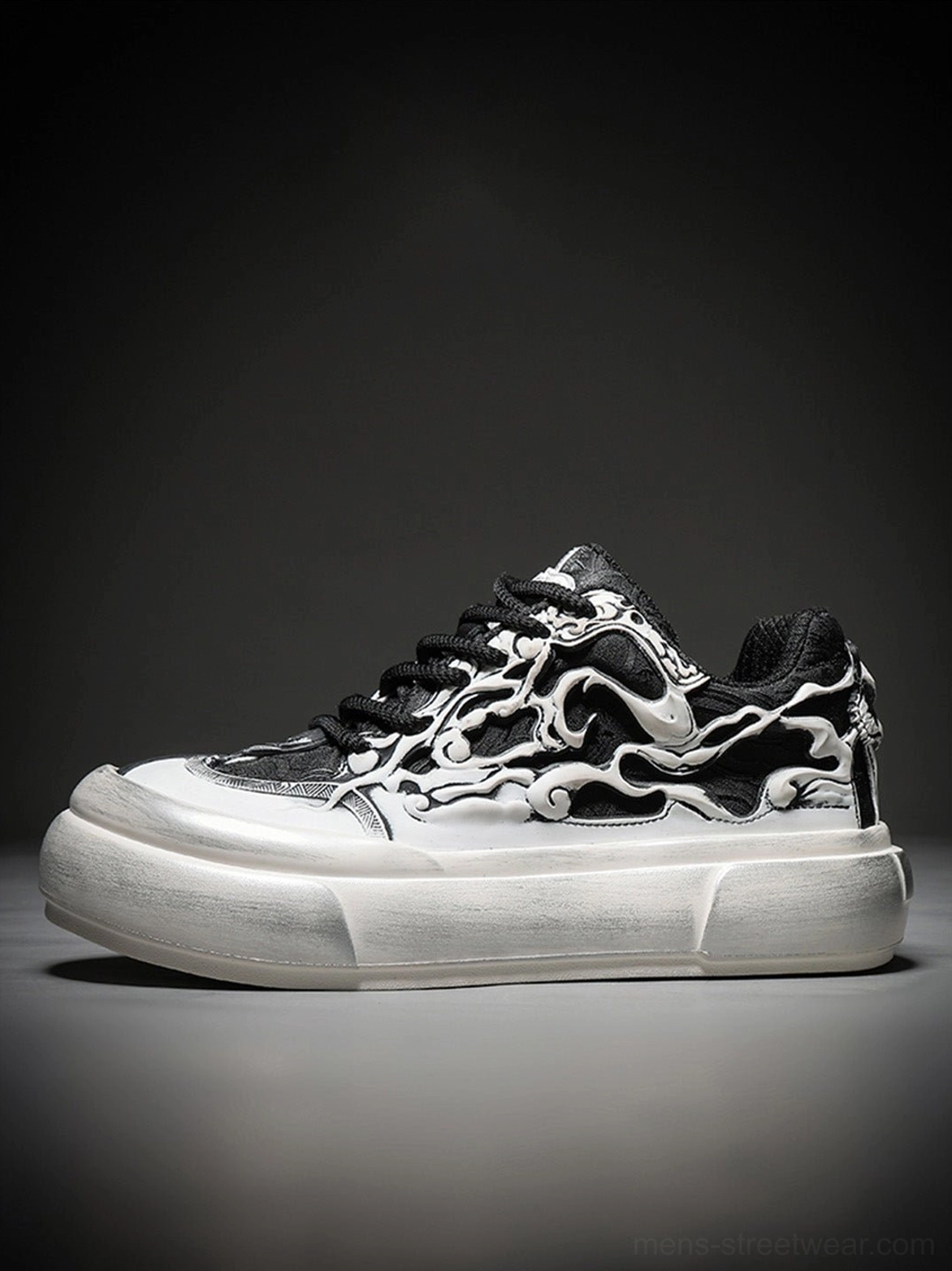 Side view of a black white Tai Chi panda chunky platform sneaker showing the rounded toe, graphic upper, and thick elevated sole