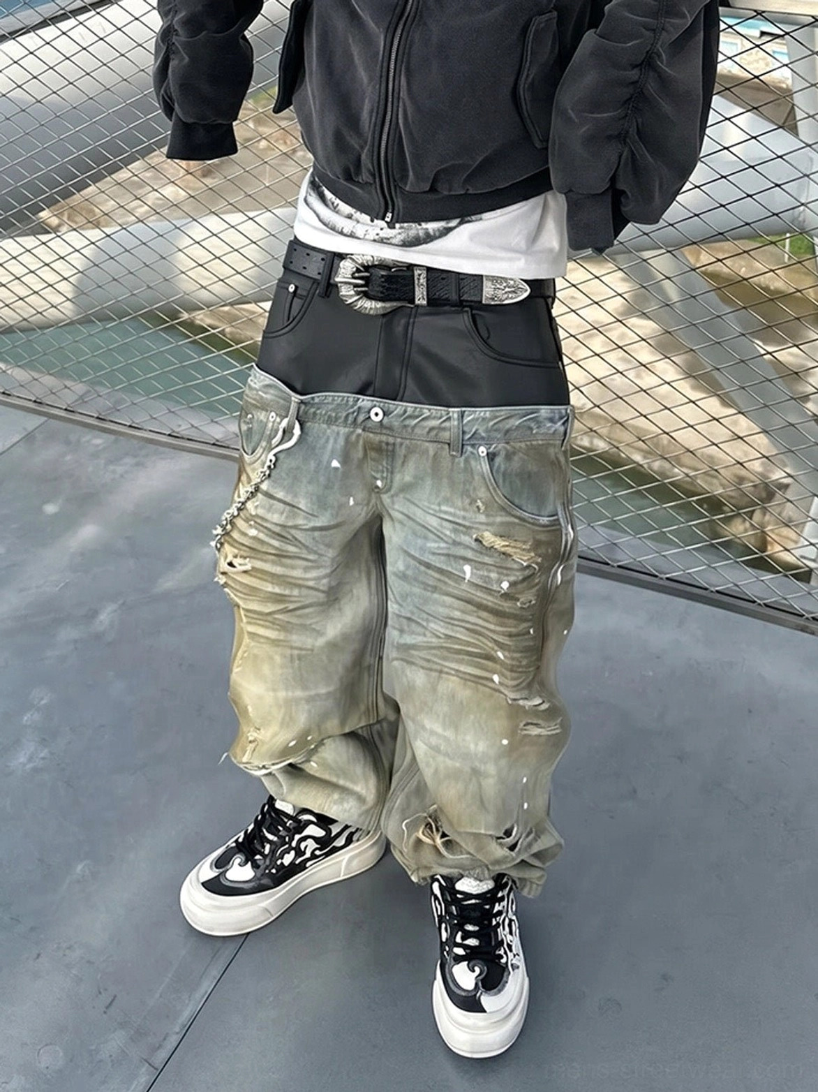 Black white graphic Tai Chi panda chunky sneakers styled with baggy distressed denim and layered Korean streetwear clothing