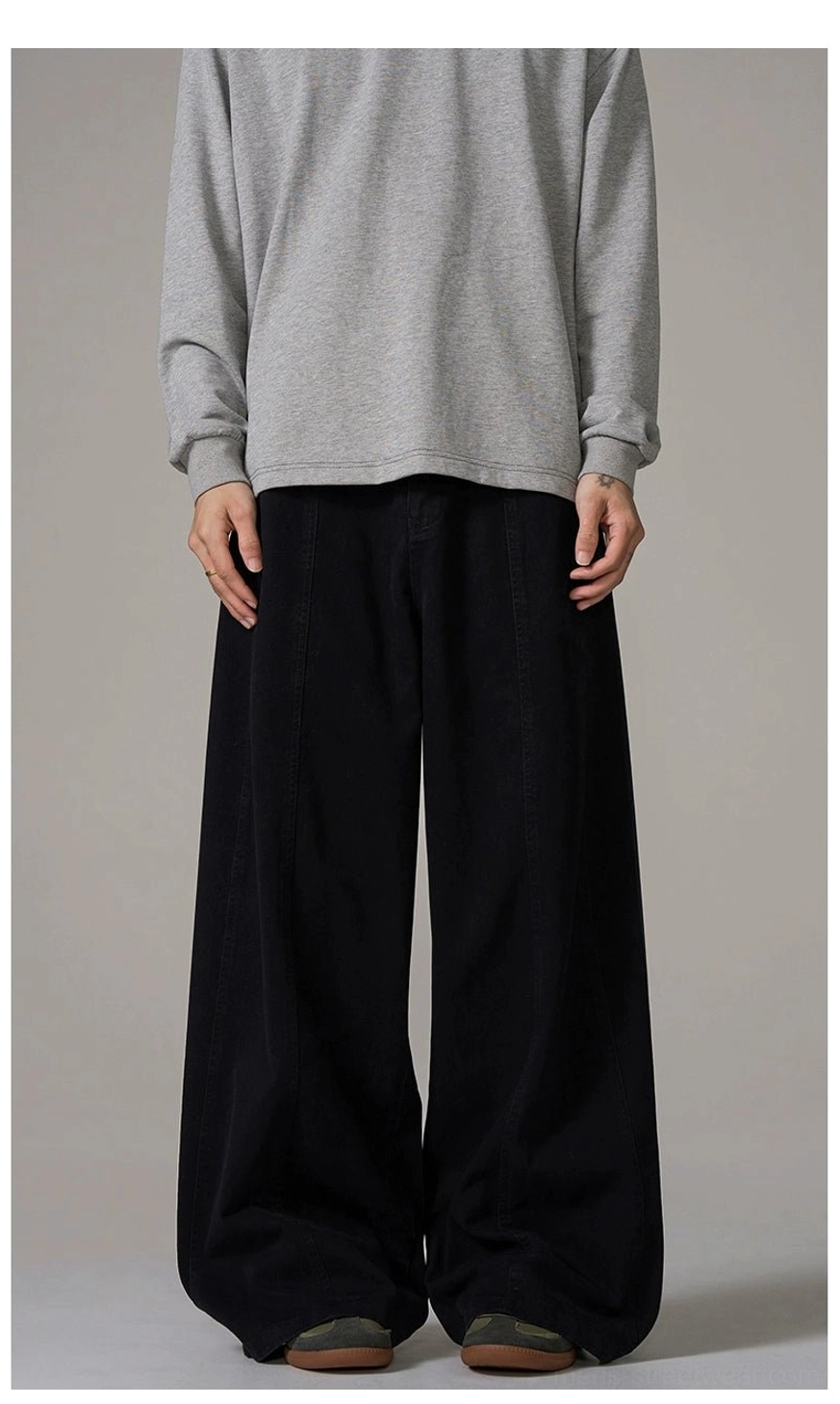 Front view of black wide-leg cotton trousers with loose silhouette and clean minimalist Korean streetwear design