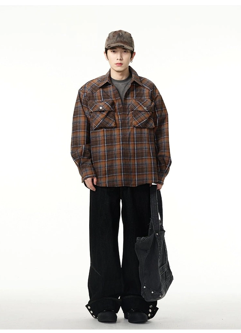 Full front streetwear outfit featuring black wide-leg cuffed jeans styled with a brown plaid shirt and casual cap for a relaxed urban look