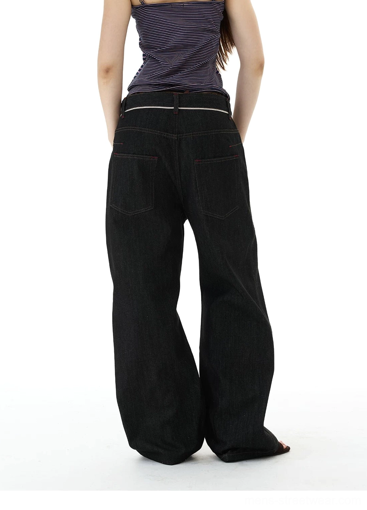 Back view of full-length black wide-leg denim jeans showing dual back pockets and contrast waistband detailing