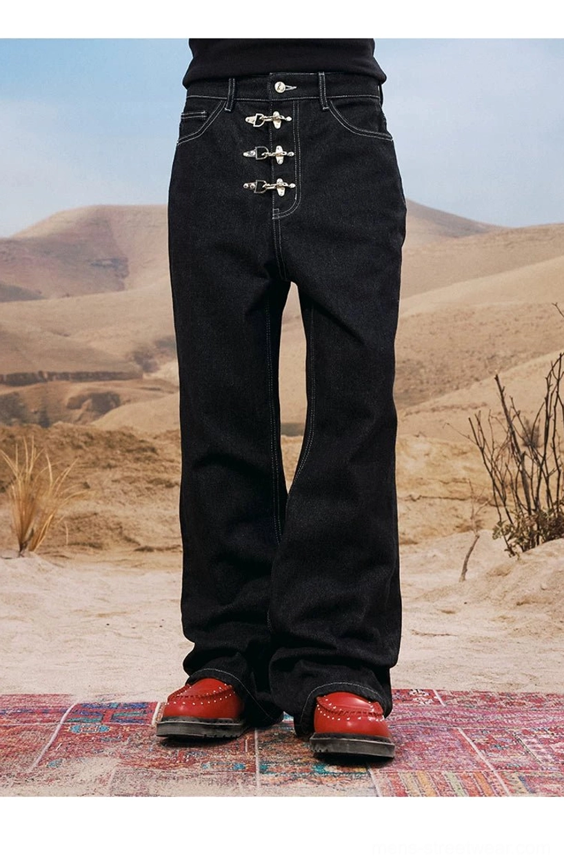 Rear full-body view of clean black wide leg denim jeans with extended leg silhouette and red leather footwear