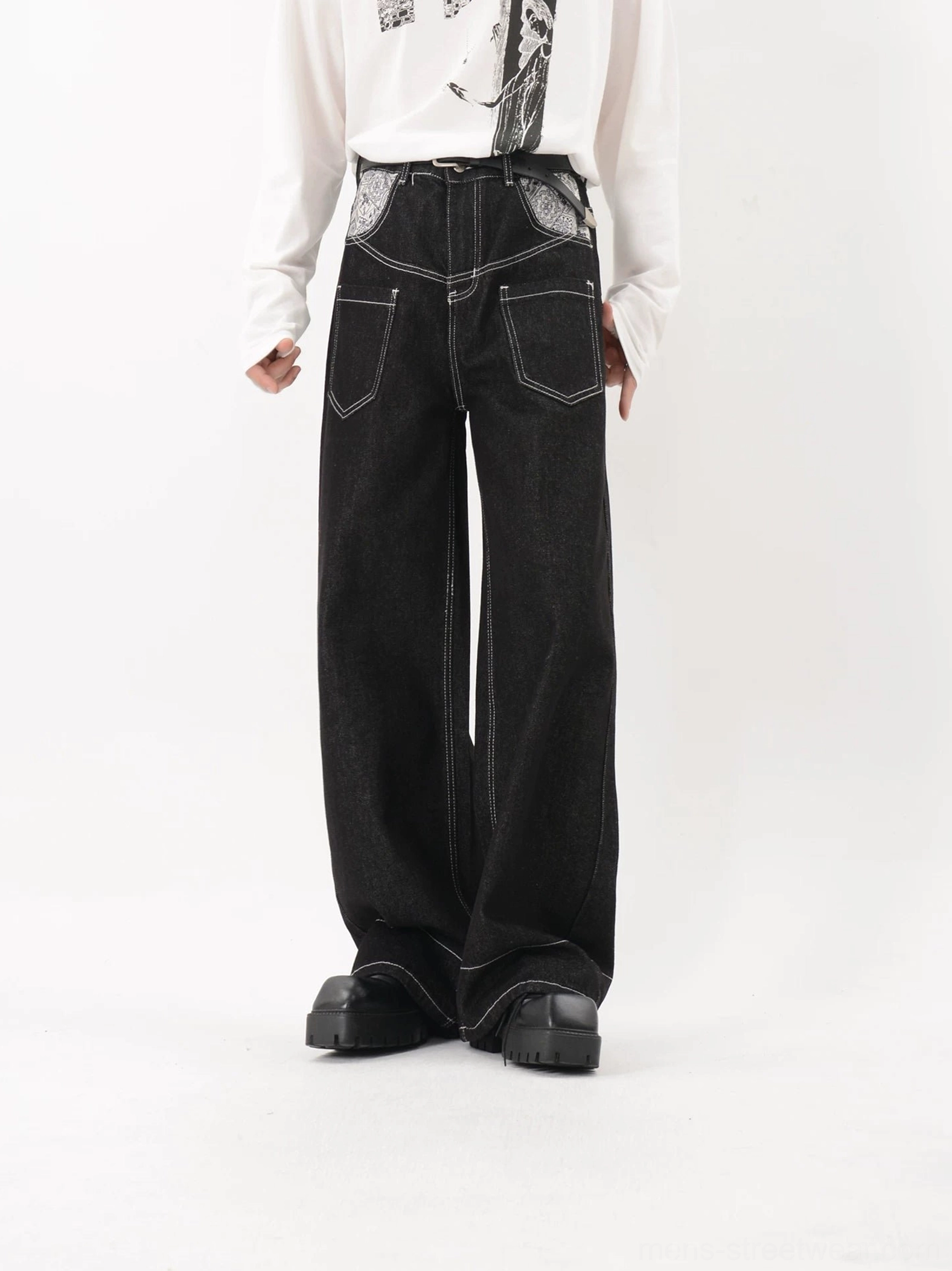 Black wide leg denim utility jeans with white contrast stitching and patterned oversized front pocket detail