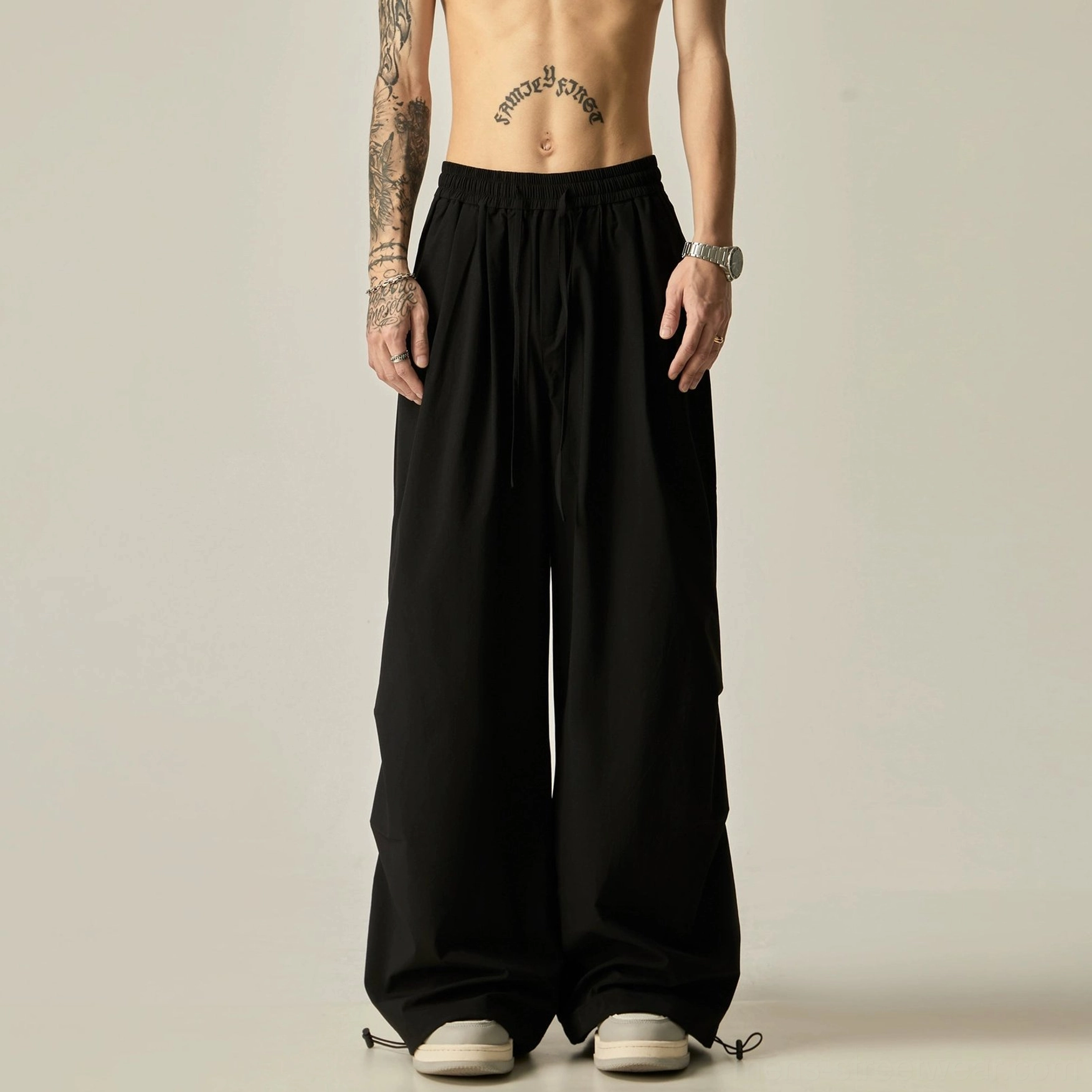 Black wide leg drawstring pants men's streetwear trousers with a flowy relaxed fit and adjustable ankle cuffs