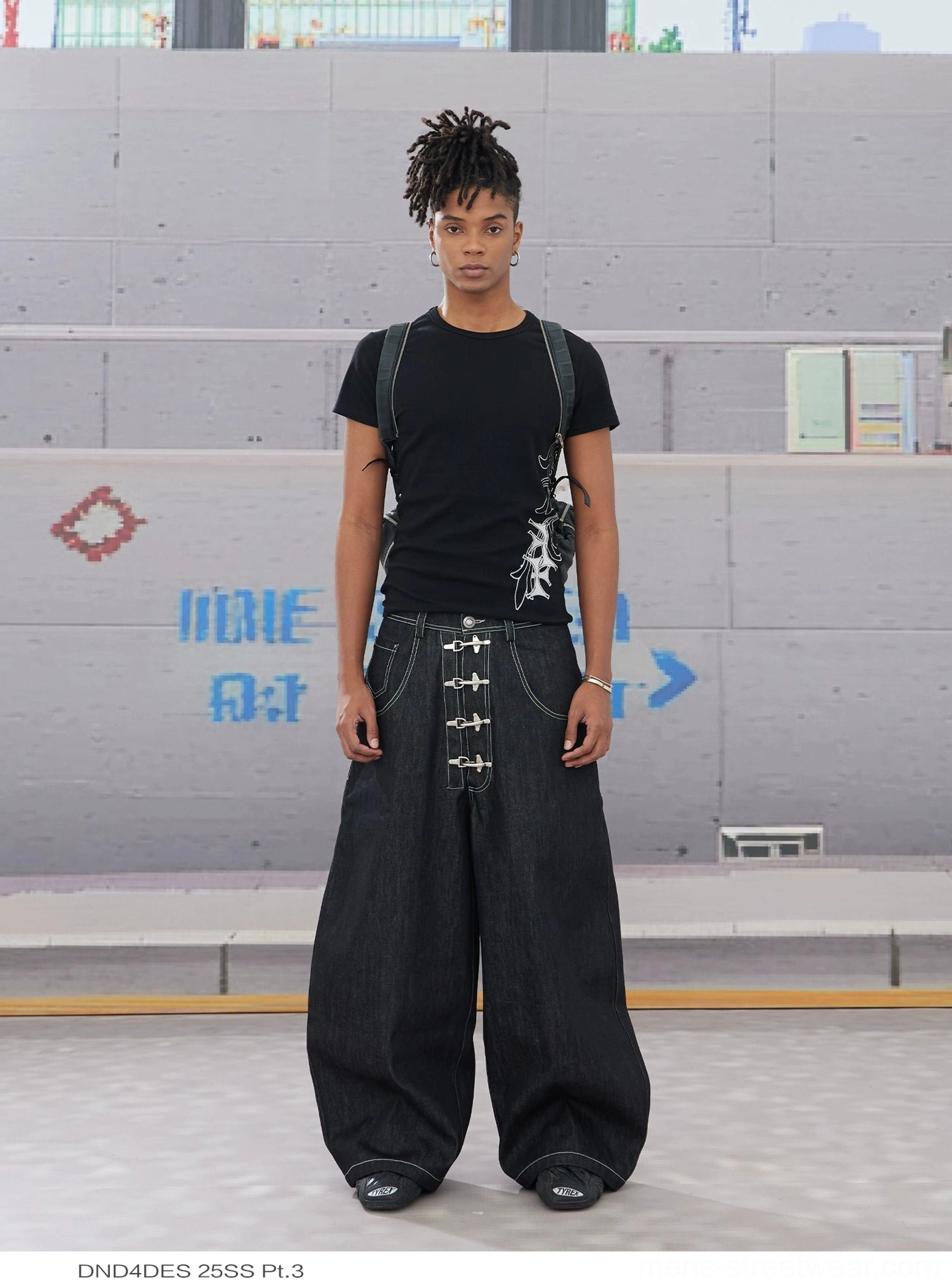 Black wide leg hook closure contrast stitch jeans front streetwear outfit with graphic black tee