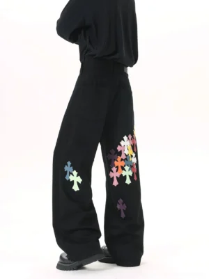 Black wide leg denim jeans with multicolor cross appliques on the back thigh and lower leg in a Korean streetwear outfit