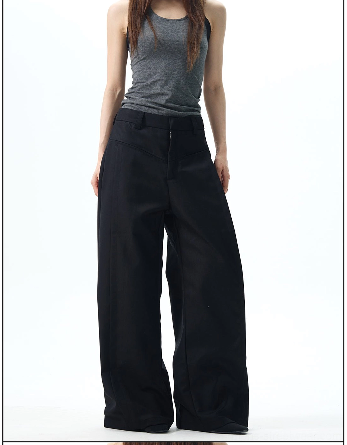 Front view of black wide-leg pants with belt loops, a structured waistband, and a clean Korean fashion silhouette
