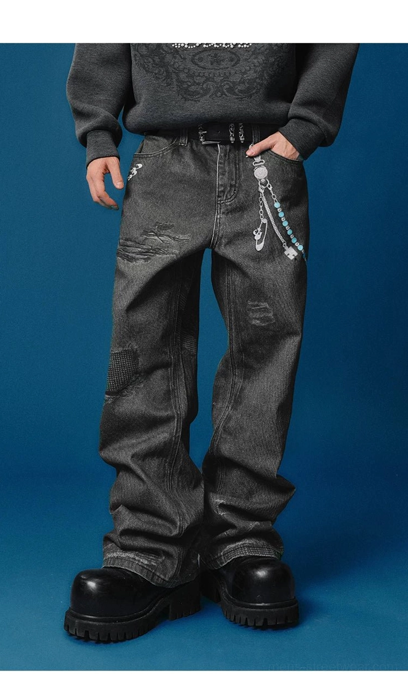 Front view of black wide-leg streetwear jeans featuring tailored distressed details, decorative waist chain, sweatshirt, and platform shoes