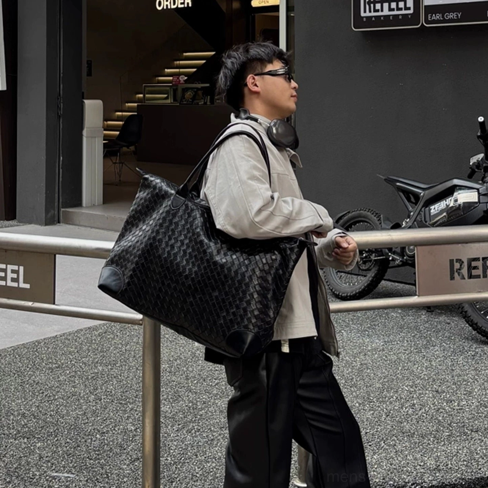 Black woven PU leather weekender tote bag for men with large everyday carry capacity