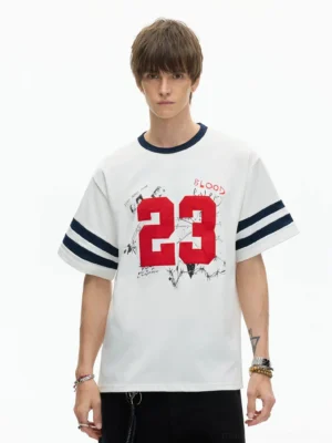 Close-up front view of white Korean streetwear varsity T-shirt showing distressed red 23 graphic, sketch details, BLOOD lettering, and navy trim