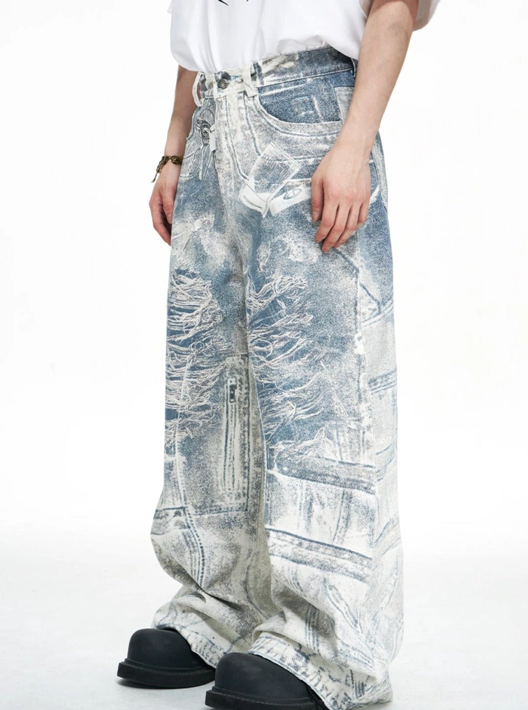 Three-quarter front view of blue acid-wash wide-leg baggy jeans with classic front pockets and faded finish
