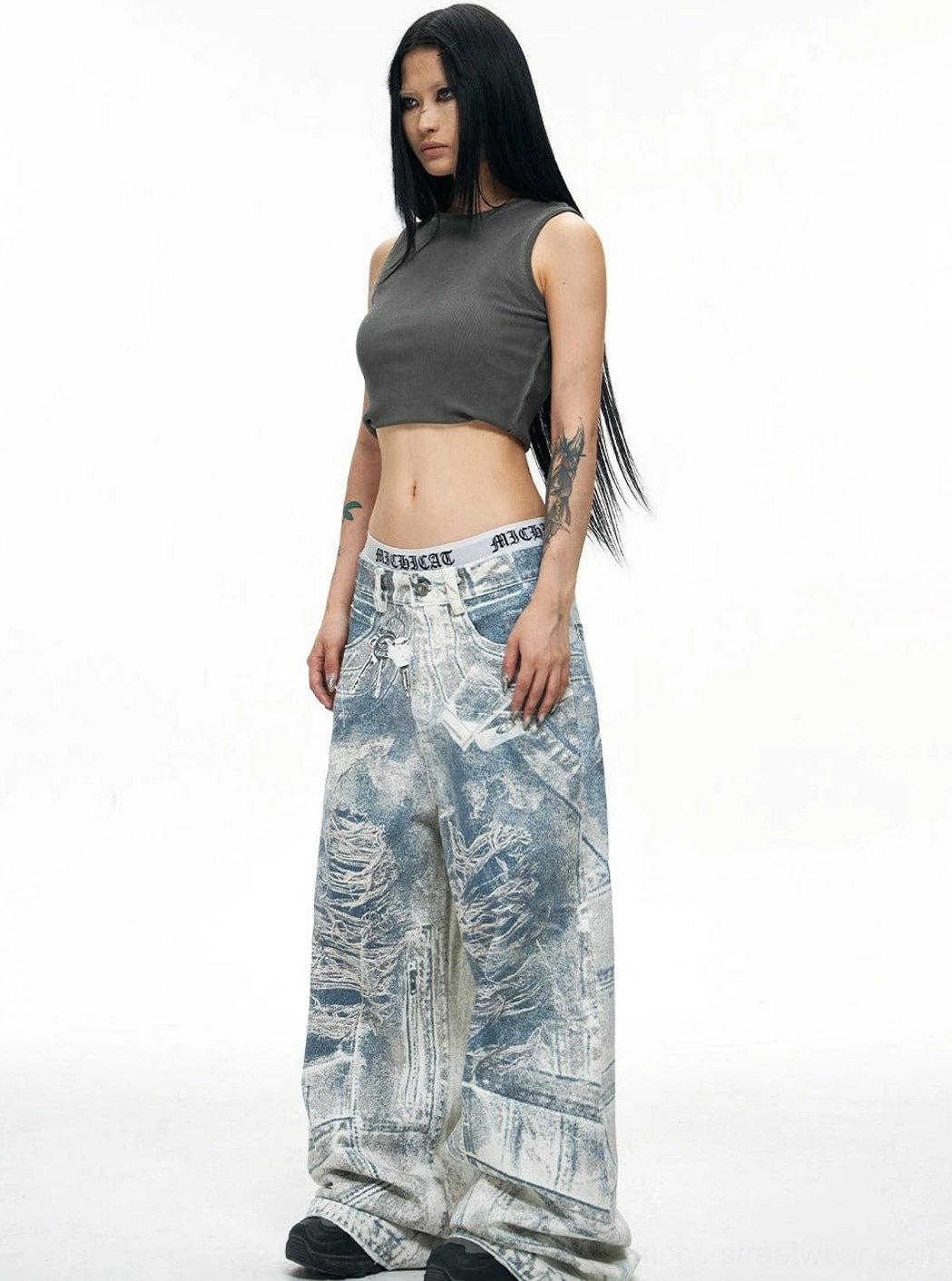 Blue acid-wash wide-leg baggy jeans styled front view with high waist and full-length oversized legs