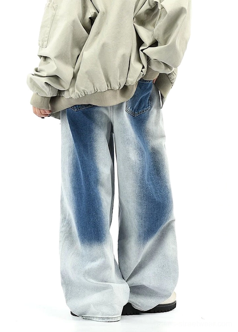 Back three-quarter view of blue gradient faded wide-leg pants showing relaxed drape and rear waistband detail