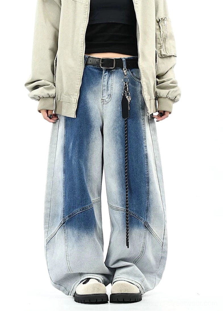 Front full-body view of blue gradient wash wide-leg pants styled with cropped top, khaki coat, and platform shoes