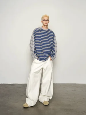Front view of a blue green dual stripe oversized sweatshirt with navy striped body light gray striped sleeves ribbed crew neck and relaxed Korean streetwear fit
