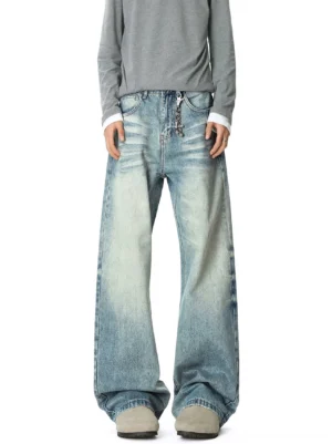 Front view of blue Korean streetwear wide-leg jeans with low-slung rise, vintage faded denim wash, waist chain, and relaxed oversized silhouette