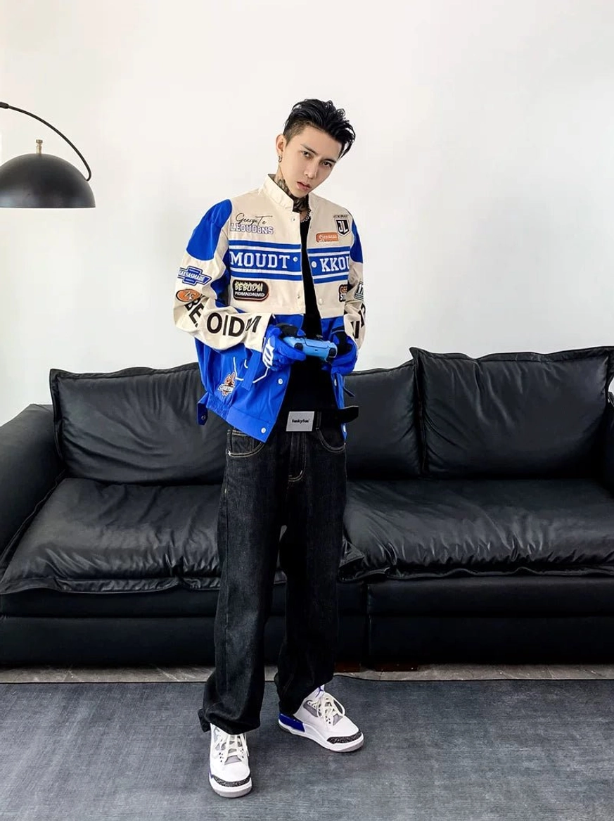 Blue and off-white motorcycle racing varsity jacket with matching blue racing gloves and coordinated blue white sneakers