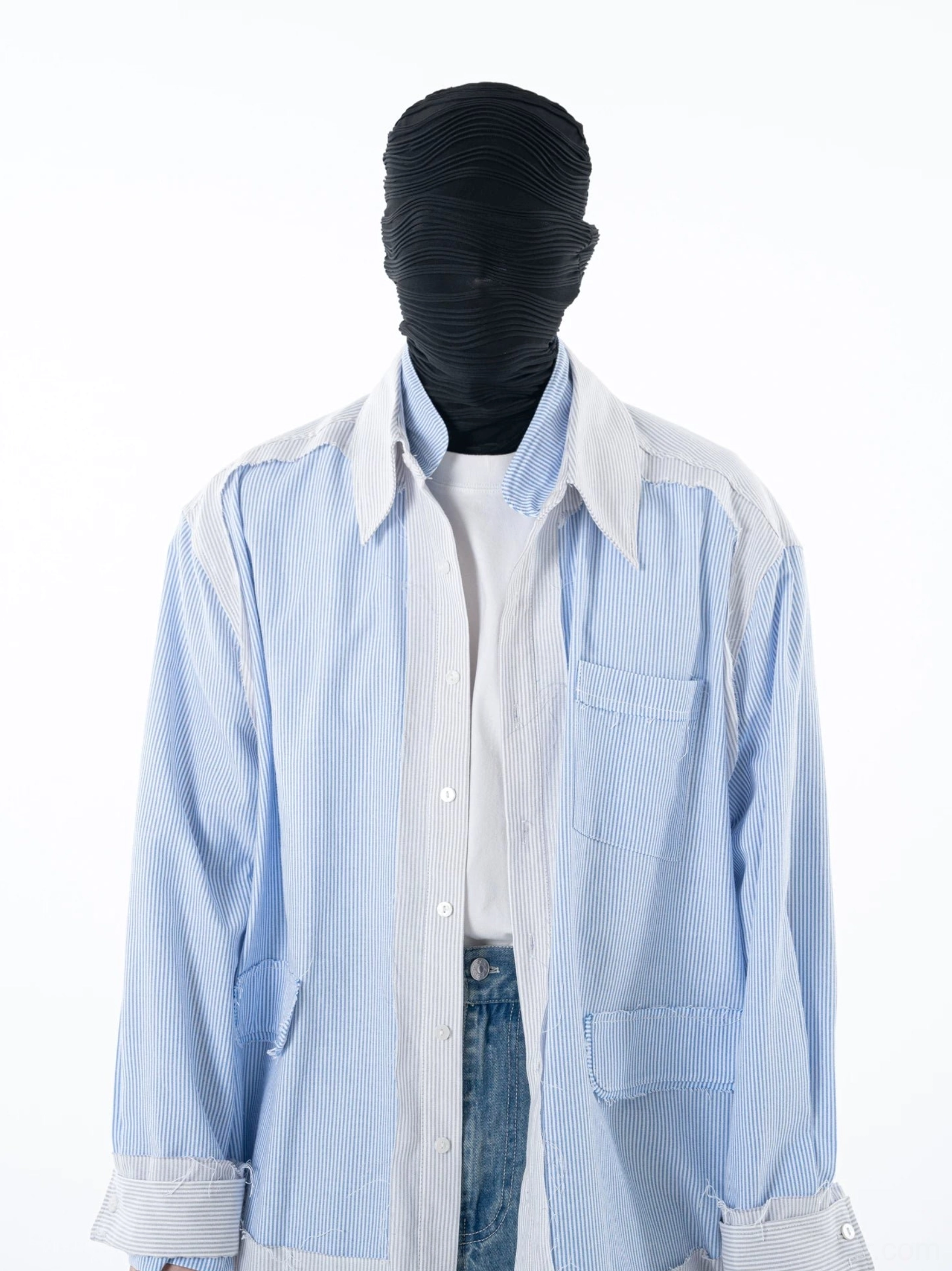 Front full-body view of a relaxed blue pinstripe shirt jacket with contrast white panels chest patch pocket and oversized Korean streetwear silhouette
