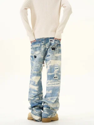Blue splash grunge wide-leg jeans with faded patchwork denim finish and distressed details styled for Korean streetwear