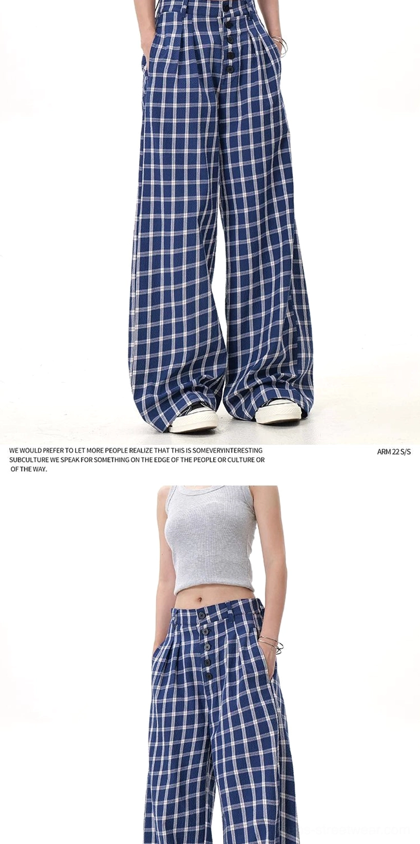 Back three-quarter view of blue and white check high-waisted wide-leg trousers with subtle waist pleats and relaxed tailoring